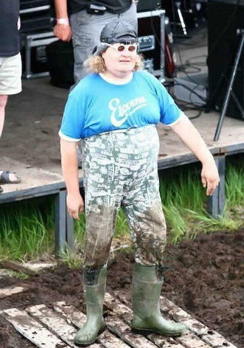 Sexig man i gummistövlar